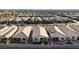 Aerial view of community, highlighting homes with solar panels and landscaped yards at 2380 Cold Canyon Ave, North Las Vegas, NV 89086