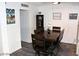 Simple dining room with dark wood table and chairs at 2804 La Canada St, Las Vegas, NV 89169