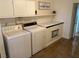 Laundry room with washer, dryer, and ample storage space at 2804 La Canada St, Las Vegas, NV 89169