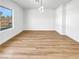 Bright and airy dining room with light hardwood flooring and a stylish light fixture at 281 E Chaparral Dr, Henderson, NV 89015