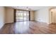 Bright living room with hardwood floors and sliding glass doors to backyard at 324 S Lisbon St, Henderson, NV 89015