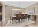 Elegant dining room featuring a large table, statement lighting, and hardwood floors at 3377 Royal Fortune Dr, Las Vegas, NV 89141