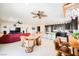 Open concept living room with kitchen views and ceiling fan at 410 Giocoso Ct, Henderson, NV 89011