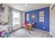 Stylish bedroom with a mid-century modern desk and teal accent wall at 4854 Currant Ridge Ave # 67, Las Vegas, NV 89141