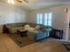 Spacious living room with large sectional sofa and tile flooring at 4873 Fuentes Cir, Las Vegas, NV 89121