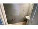 Small bathroom with pedestal sink and toilet at 5408 Indian Rose St, North Las Vegas, NV 89031