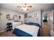 Well-lit bedroom with a comfortable bed and built-in dresser at 5517 Porcupine Rim St, Las Vegas, NV 89130