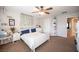 Bedroom with a white queen bed and built-in shelving at 5517 Porcupine Rim St, Las Vegas, NV 89130