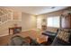 Spacious living room featuring a comfortable sectional sofa and a wooden coffee table at 5517 Porcupine Rim St, Las Vegas, NV 89130