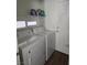 Clean laundry room with washer and dryer, and storage at 5901 Enchanted Palms Ave, Las Vegas, NV 89139