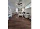 Living room with hardwood floors, white sofa, and coffee table at 5901 Enchanted Palms Ave, Las Vegas, NV 89139