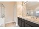 Bathroom with double vanity and dark brown cabinets at 6423 Tigers Lair Ct, Las Vegas, NV 89130