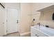 Laundry room with built-in sink and cabinets at 6423 Tigers Lair Ct, Las Vegas, NV 89130