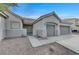 Front view of single-story house with two-car garage at 673 Kentons Run Ave, Henderson, NV 89052