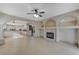 Open concept living area with a view into the kitchen and fireplace at 673 Kentons Run Ave, Henderson, NV 89052