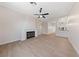 Open living room with fireplace and view into the kitchen and dining area at 8100 Sedona Sunset Dr, Las Vegas, NV 89128