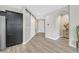 Bright and airy entryway with wood-look floors and barn door at 963 Mill Run Creek Ave, Henderson, NV 89002