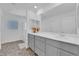 Elegant bathroom with double vanity, large mirror, and shower at 10375 Rose Palisade St, Las Vegas, NV 89141