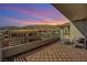 Enjoy breathtaking sunset views from this expansive balcony at 10749 Steel Ridge Ct, Las Vegas, NV 89135