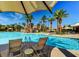 Relaxing pool area with lounge chairs and palm trees at 151 Duckhook Ave, Las Vegas, NV 89148