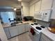 Galley kitchen with white appliances and ample counter space at 1916 Las Palmas Ln # 214, Laughlin, NV 89029