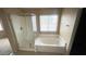 Bathroom with walk-in shower and a separate tub at 2012 Pink Lily Ave, North Las Vegas, NV 89081