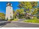 Inviting community clubhouse with a charming architectural design and lush landscaping at 2212 Plaza De La Candela, Las Vegas, NV 89102