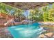 Inviting pool with a waterfall feature and lush landscaping at 2212 Plaza De La Candela, Las Vegas, NV 89102