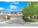 Two-story house with a red door, attached two-car garage, and a well-manicured lawn at 2336 Tilden Way, Henderson, NV 89074