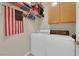 Convenient laundry room with washer, dryer, and shelving at 2336 Tilden Way, Henderson, NV 89074