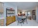 Kitchen with wooden cabinetry, a round dining table and views to living room at 2535 Evening Twilight Ave, Henderson, NV 89044