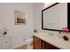 Clean bathroom with modern vanity and large framed mirror at 26 Costa Tropical Dr, Henderson, NV 89011