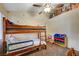 Bedroom with bunk beds, ceiling fan, and playful decor at 2725 S Nellis Blvd # 2022, Las Vegas, NV 89121