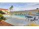 Community pool with surrounding patio furniture at 2725 S Nellis Blvd # 2022, Las Vegas, NV 89121