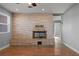 Living room boasts a beautiful stone fireplace and hardwood floors at 2925 Rice St, Logandale, NV 89021