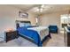 Serene bedroom with a blue comforter and ceiling fan at 3258 Epson St, Las Vegas, NV 89129