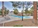 Inviting community pool with surrounding landscaping and lounge chairs at 3258 Epson St, Las Vegas, NV 89129