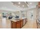 Open concept kitchen with island, stainless steel appliances, and granite countertops at 3978 Jacob Lake Cir, Las Vegas, NV 89118