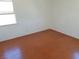 Simple bedroom featuring hardwood flooring and a window at 412 S Maryland Pkwy, Las Vegas, NV 89101