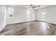 Light and airy living room with gray vinyl flooring and access to backyard at 5327 Caprock Canyon Ave, Las Vegas, NV 89139