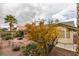 Backyard view showcasing a fire pit and desert landscaping at 6105 Heather Mist Ln, Las Vegas, NV 89108