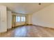 Spacious living room featuring tile floors and large windows at 6105 Heather Mist Ln, Las Vegas, NV 89108