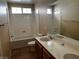 Bathroom with double vanity, bathtub, and shower at 6308 Villa Emo St, North Las Vegas, NV 89031