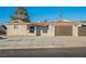 Single-story home with a brown garage door and landscaping at 6750 Laronda Ln, Las Vegas, NV 89156