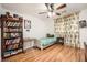 Bright bedroom with wood floors, built-in shelving, and window coverings at 689 Iron Bridge St, Las Vegas, NV 89178