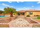 Relaxing firepit area with stone steps and desert landscaping at 7119 Wolf Rivers Ave, Las Vegas, NV 89131