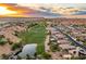 Aerial view of community with lake, golf course, and sunset views at 1004 Crest View Dr, Mesquite, NV 89027