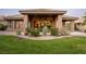 House exterior showcasing stone accents and landscaped yard at 1004 Crest View Dr, Mesquite, NV 89027