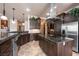 Spacious kitchen with stainless steel appliances, granite countertops, and custom cabinetry at 1004 Crest View Dr, Mesquite, NV 89027