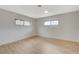 Light and bright bedroom with wood-look floors and multiple windows at 106 Manganese St, Henderson, NV 89015